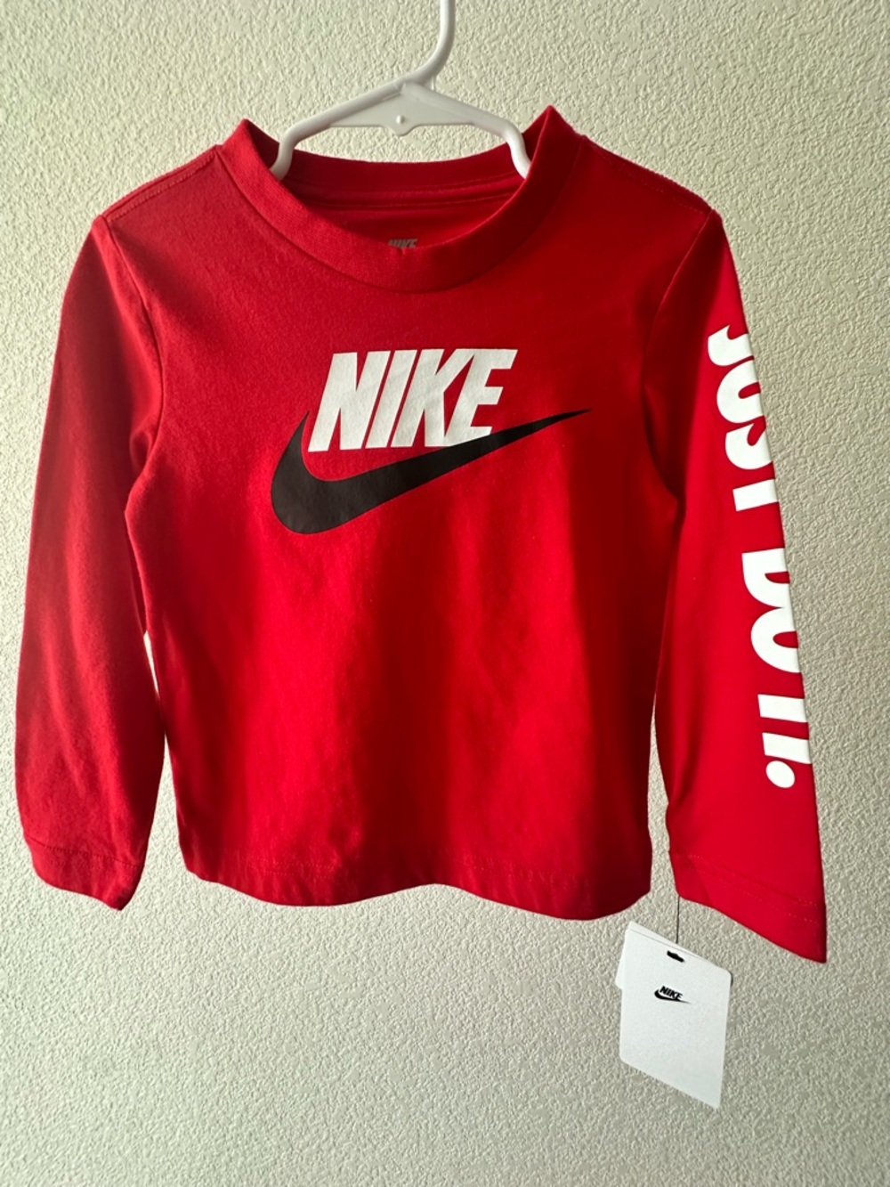 Nike Red Long-Sleeve Kids Tee with White Logo and Black Swoosh
